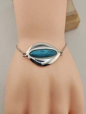 Adjustable Silver Tone Bracelet with Blue Accent Stone
